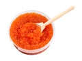 Plastic container with red caviar and big spoon Royalty Free Stock Photo