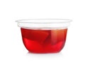 Plastic container with tasty jelly on white