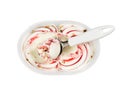 Plastic container with vanilla-strawberry ice cream and nuts Royalty Free Stock Photo