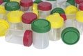 Plastic containers for the collection of biological fluids with multicolored caps