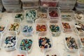 Plastic containers with smalt on the table, selective focus. Regular or irregular pieces of colored stone or ceramic known as Royalty Free Stock Photo