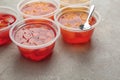 Plastic containers with tasty jelly desserts Royalty Free Stock Photo