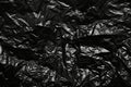 Plastic crumpled black polyethylene bag background