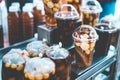 A plastic cup and plastic bag of cold assorted beans, lotus roots, ginkgo, longan and sweet syrup in street food shop in asian for