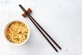 Plastic cup of instant ramen noodles, shot from above with chopsticks Royalty Free Stock Photo