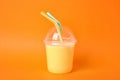 Plastic cup of tasty milk shake Royalty Free Stock Photo