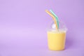Plastic cup of tasty milk shake and space for text Royalty Free Stock Photo