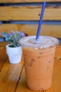A plastic cup of Thai tea with ice. Royalty Free Stock Photo