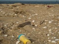 Plastic debris bottlecaps styrofoam garbage on beach Royalty Free Stock Photo