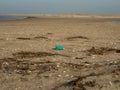 Plastic debris bottlecaps styrofoam garbage on beach Royalty Free Stock Photo