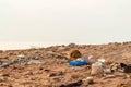 Plastic debris Waste Litter on Ground pollutes sand beach sea, Earth day concept. Save the planet nature from garbage trash