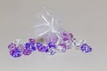 Plastic diamonds in a silk bag Royalty Free Stock Photo