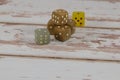 Plastic Dices on White Wooden Table: Gambling Theme Royalty Free Stock Photo