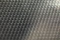 Abstract background of lots of grey pimples dots. Plastic surface with pimples