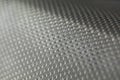 Abstract background of lots of grey pimples dots. Plastic surface with pimples