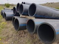 Plastic drainage pipes  pile connecting each other by the road Royalty Free Stock Photo