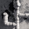 Plastic drainage pipes on white gauge wall Royalty Free Stock Photo