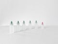 Plastic dropper bottles with a colored cap Royalty Free Stock Photo