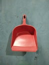 Plastic dustpan garbage isolated on green background Royalty Free Stock Photo