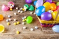 Plastic easter eggs being filled with chocolates before easter egg hunt. Royalty Free Stock Photo