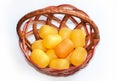 Plastic egg boxes in basket on the white background. Royalty Free Stock Photo