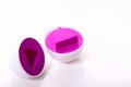 Plastic egg developmental puzzle purple color with a triangle sh