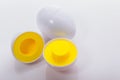 Plastic egg developmental puzzle yellow to form a circle on a white background. Royalty Free Stock Photo