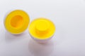 Plastic egg developmental puzzle yellow to form a circle on a white background. Royalty Free Stock Photo