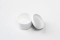 Plastic and empty white box on white background. Small,opened packaging mockup for medicine. Round design Royalty Free Stock Photo
