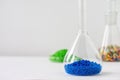 Plastic factory laboratory. Glass flasks with colored dye in granules for plastics. polymer industry Royalty Free Stock Photo