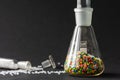 Plastic factory laboratory. Glass flasks with colored dye in granules for plastics. polymer industry Royalty Free Stock Photo