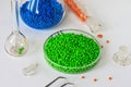 Plastic factory laboratory. Glass flasks with colored dye in granules for plastics. polymer industry Royalty Free Stock Photo