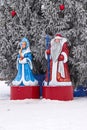 Plastic figures of Santa Claus and snow Maiden on the square decoration for Christmas at the Christmas tree Royalty Free Stock Photo