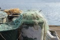 Plastic fishing nets in large vats on the quay in the port on the Baltic sea, copy space, selected focus