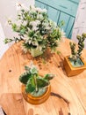 plastic flower decoration placed on a wooden table