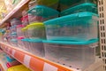 Plastic food containers on a shelf in a store. Colorful containers on a shelf. Abstract background. close-up Royalty Free Stock Photo