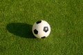 Plastic Football or soccer ball on green grass
