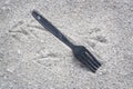 Plastic Fork & Footprints Royalty Free Stock Photo