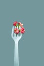 Plastic fork holding plant is close