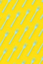 Plastic forks flat lay on yellow background Royalty Free Stock Photo