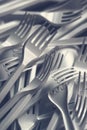 Plastic forks scattered on wooden table Royalty Free Stock Photo