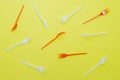Plastic forks on yellow background Royalty Free Stock Photo