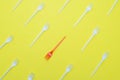 Plastic forks on yellow background Royalty Free Stock Photo