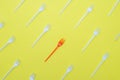 Plastic forks on yellow background Royalty Free Stock Photo