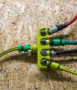 Plastic four-channel distributor to supply water for garden different connected hoses