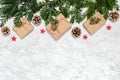 Plastic free Christmas flat lay with handmade giftboxes, conifer tree branches, pine cones, wooden stars on marble background. Royalty Free Stock Photo