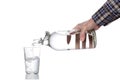 Plastic free concept: man`s hand fill a water glass with a glass  bottle, clipping path included, isolated on white background an Royalty Free Stock Photo