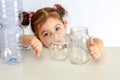 Plastic free, save planet concept. Child showing thumb up for glass jar, thumbs down for plastic bottle