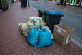 Plastic Garbage Bags and Bins on Sidewalk