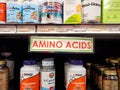 Amino Acids sign and products line store shelves